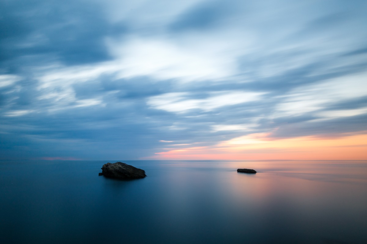 Reduktion in der Landschaftsfotografie am Beispiel Sonnenuntergang am Rocher de la Vierge in Biarritz am Atlantik